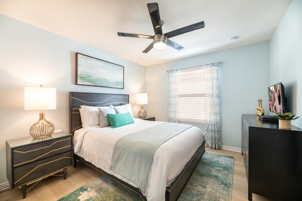 King bedroom with charcoal headboard detail at Magic Moments Kissimmee vacation villa