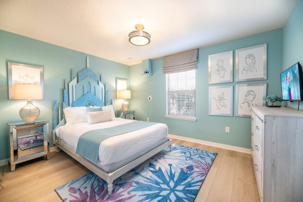 Frozen themed bedroom with teal castle headboard at Magic Moments Kissimmee vacation villa