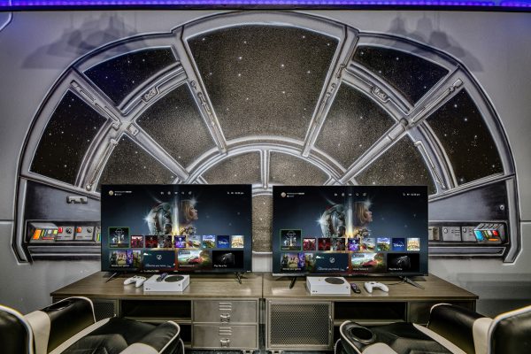 Star Wars themed game room gaming station with console and TV at Magic Moments Kissimmee vacation villa